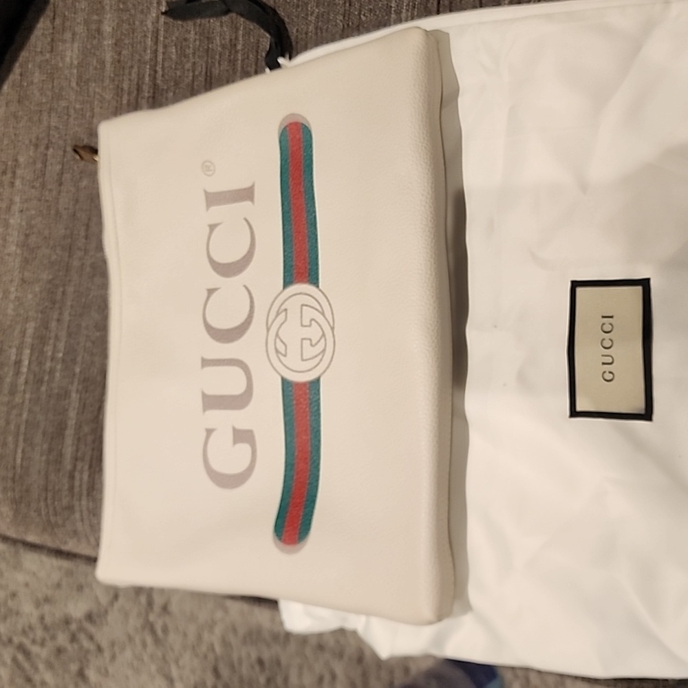 Gucci Calf leather pouch. New never been used. It's been sitting in my closet.